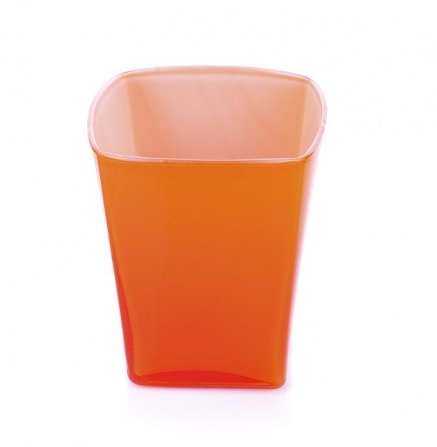 Red plastic glass on a white background