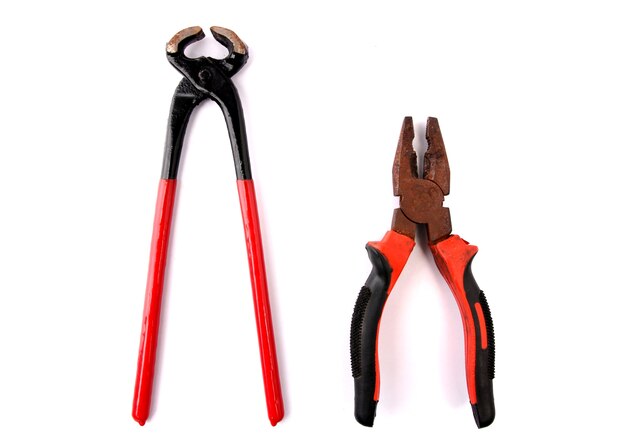 Red pliers with white backdrop.