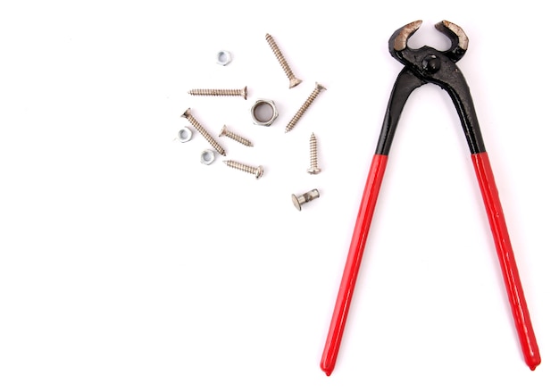 Red pliers with white backdrop.