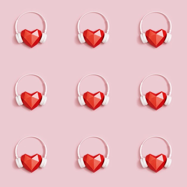 Photo red polygonal paper heart shape with headphones