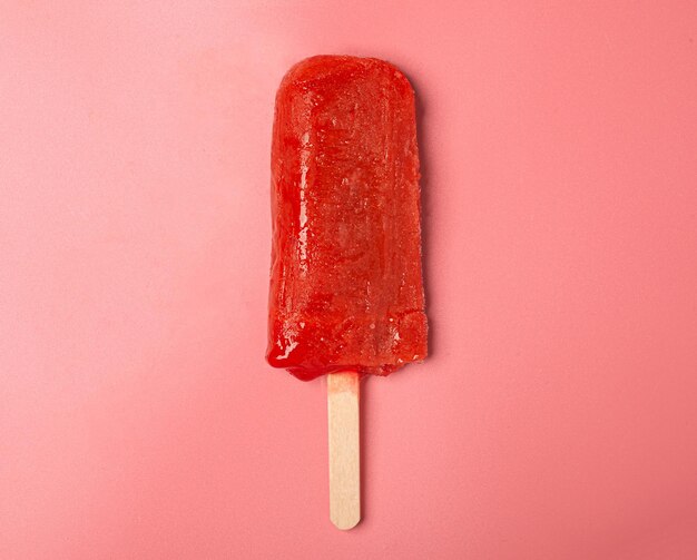 Red popsicles ice cream isolated on pink background