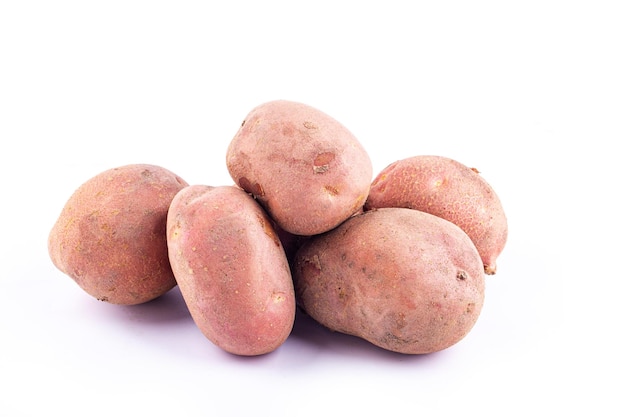 Red potatoes on white background