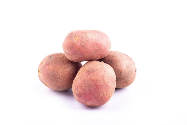 Red potatoes on white background