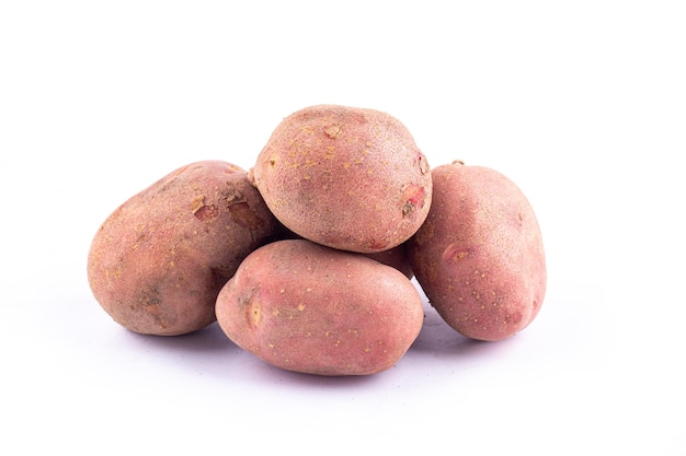 Red potatoes on white background