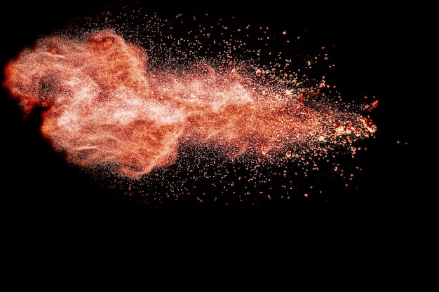 Red  powder explosion on black background.