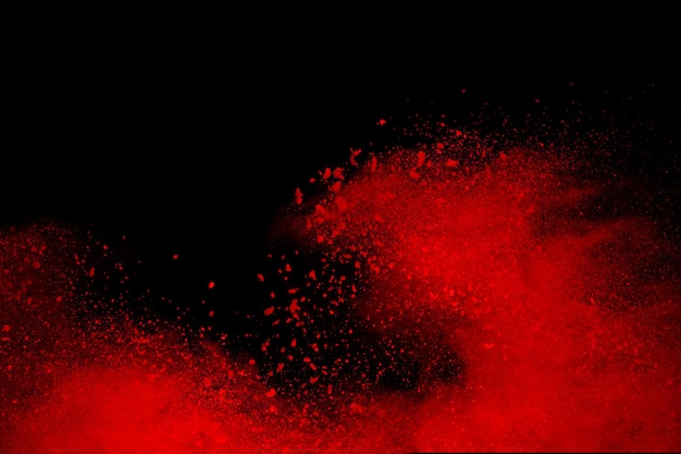 Red powder explosion on black background