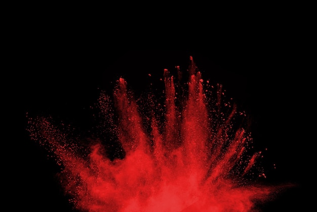 Photo red powder explosion isolated on black