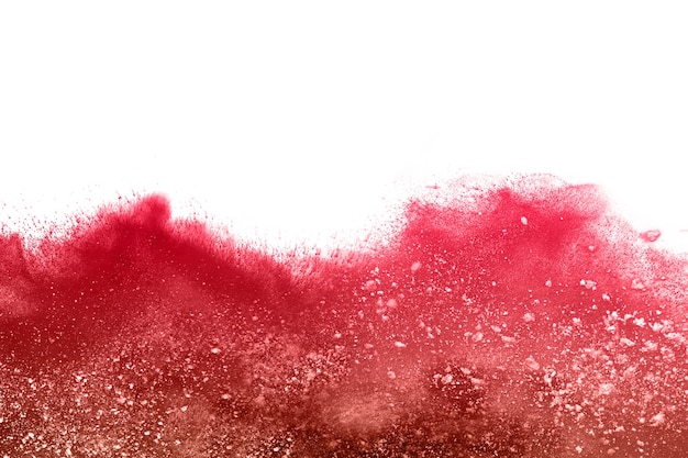 Red powder explosion on white background