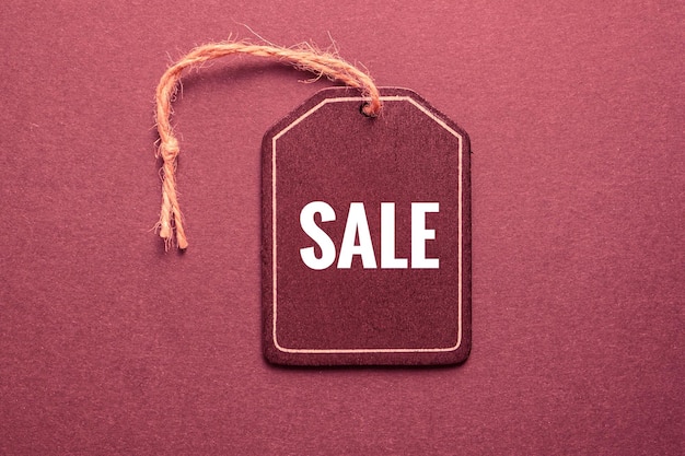 red price tag with sale sign on the red background, red mockup