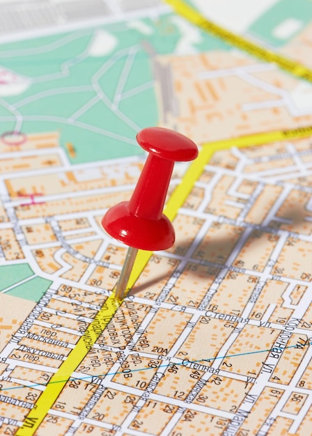 Photo red pushpin on a map