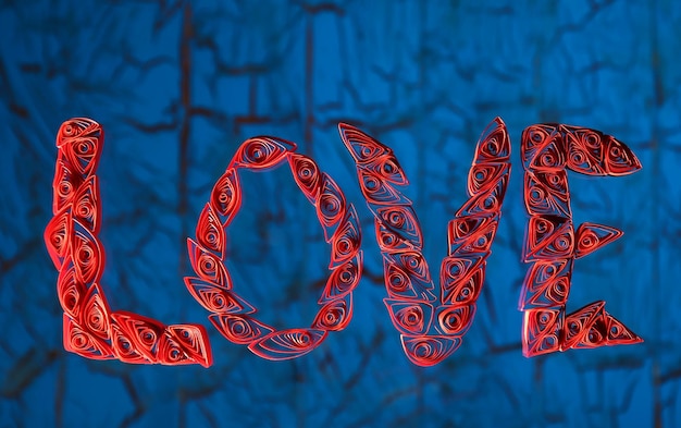 Photo red quilling word love on a glass over blue wooden background