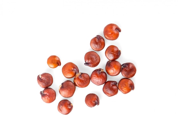 Red quinoa isolated on white. top view