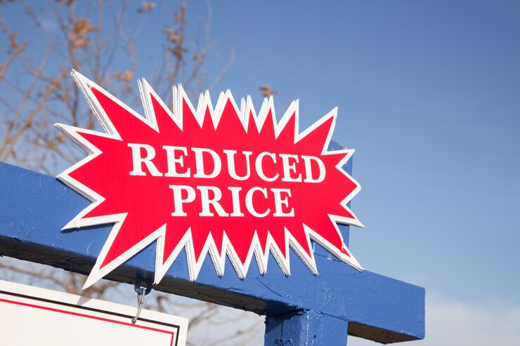 Photo red reduced price burst sign