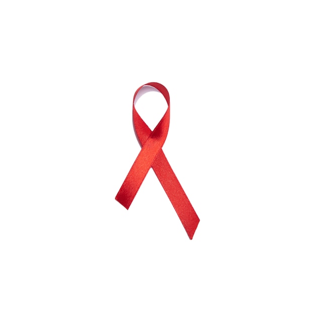 Photo red ribbon against aids isolated on white