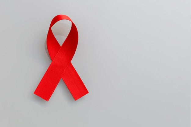 Red ribbon of AIDS prevention and blood donation awareness campaign.