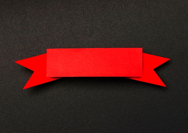 Red ribbon on black background