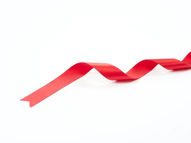 Red ribbon curved isolated on white