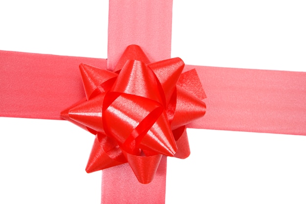 Red ribbon of gift on a over white background