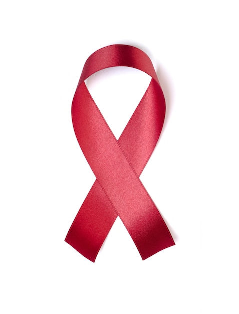 Red ribbon isolated on white background for sign world aids day