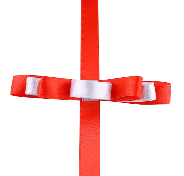 Photo red ribbon and red and white bow isolated on white