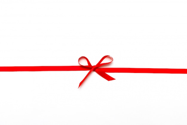 Red ribbon or rope tied in bow isolated on white 
