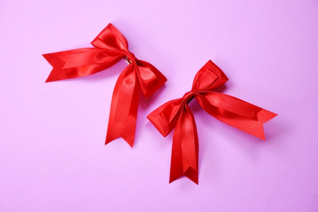 Red ribbons on pink