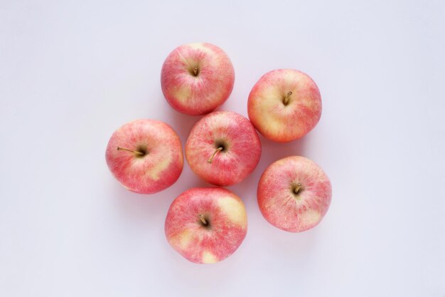 Red ripe apples closeup on a white background Top view