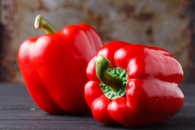 Red ripe bulgarian pepper on rustic table