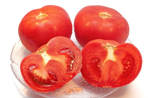 Red ripe fresh tomatoes isolated on white background