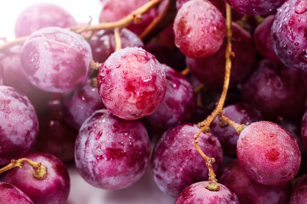 Red ripe grape over white