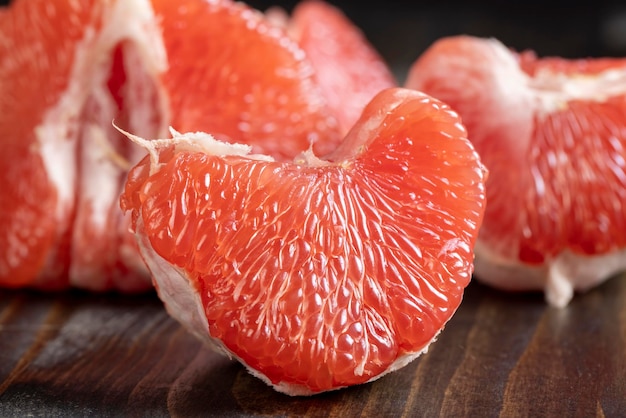 Red ripe grapefruit on a cutting board