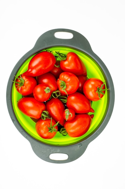 Red ripe oval tomatoes. Studio Photo.