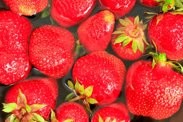 Red ripe strawberry process of washing of fresh strawberry fresh berries of strawberry in water