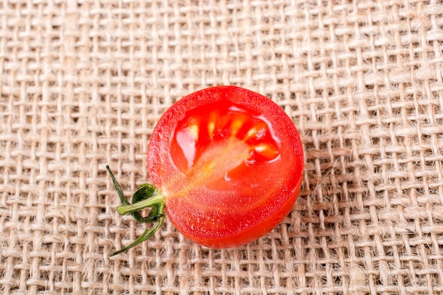 Red ripe tasty fresh cherry tomatos cut in halves