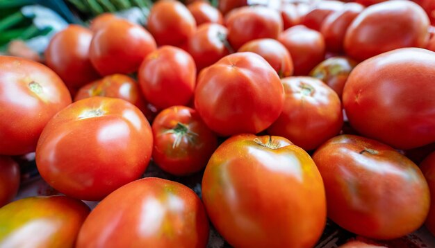 Red ripe tomatoes closeup on the farm market stall Food background