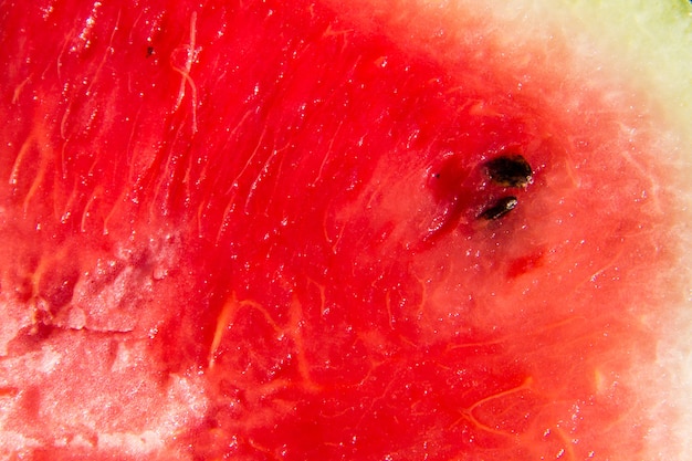 Foto struttura rossa matura della frutta dell'anguria per il fondo