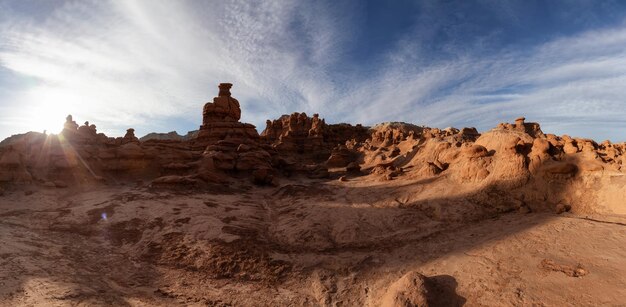 Red rock formations in desert at sunny sunrise spring season