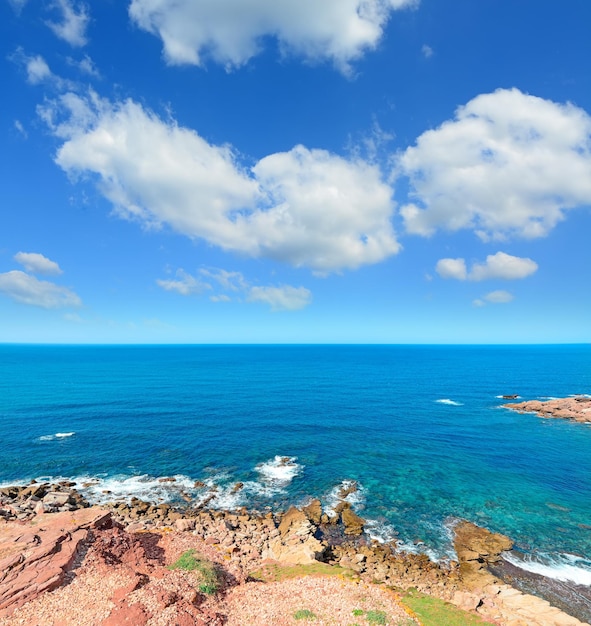 Red rocks in Porticciolo shoreline Sardinia