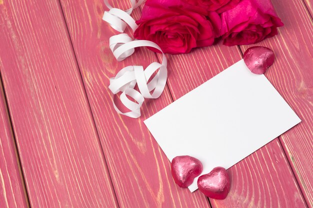 Red rose and blank gift card for text