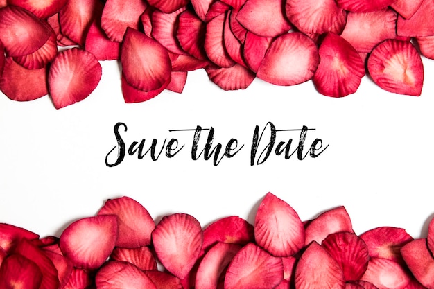 Red rose petals with save the date message