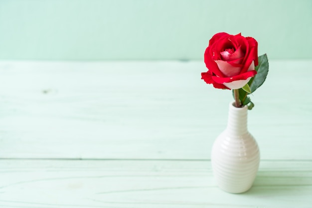 red rose on wood