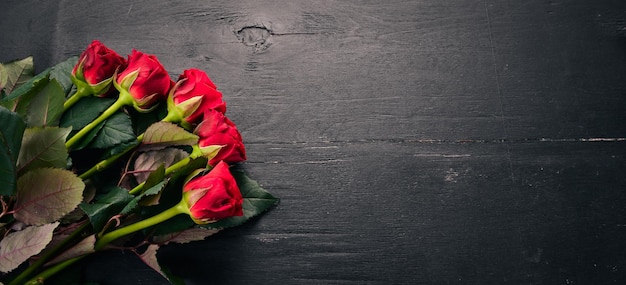 Red rose on a wooden background. valentines day. love. top view. free space for your text