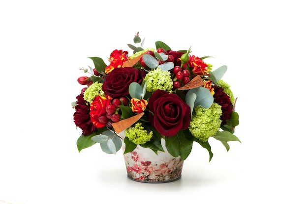 Red roses and an assortment of flowers in a pot. Valentine's Day