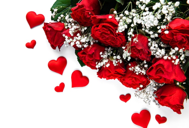 Red roses bouquet on a white surface