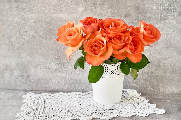 Red roses bouquet in white vase