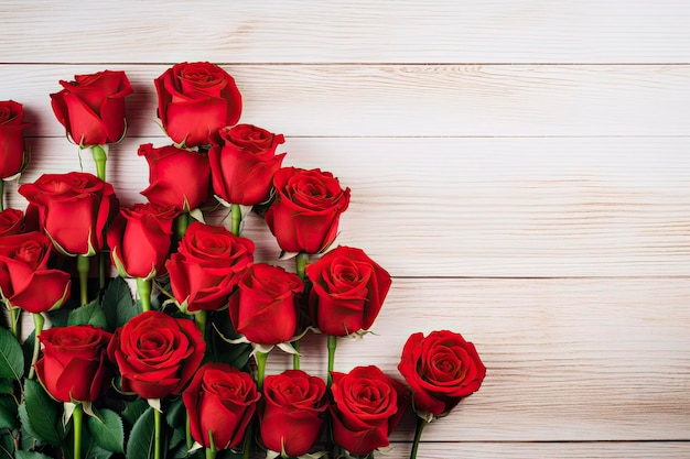 red roses bouquet on white wooden table Top view Copy space