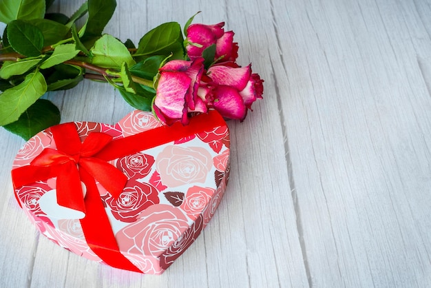 Red roses and gift box