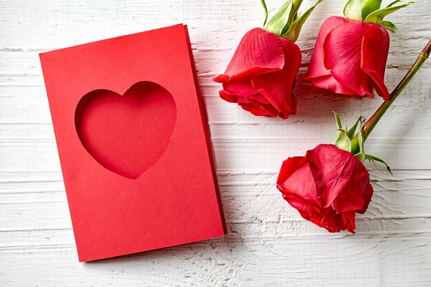 red roses and greeting card