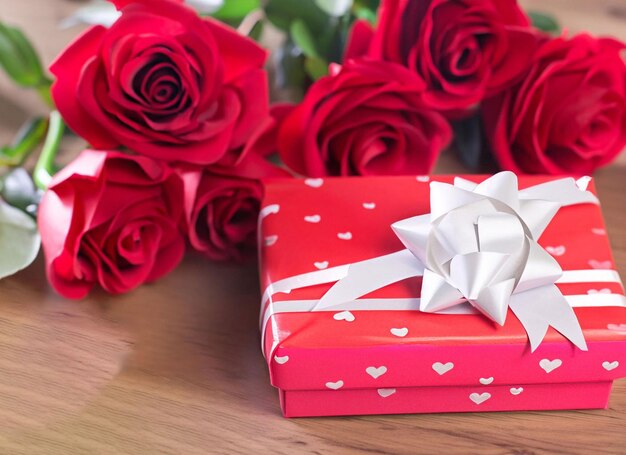 red roses with decorative hearts and presents