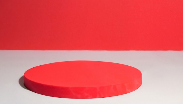A red round object is in front of a red background.